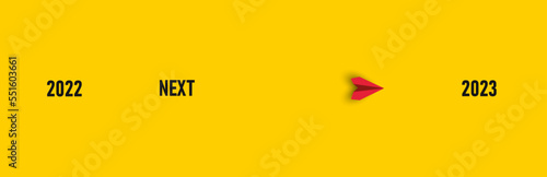 Red paper airplane flying from Next to 2023. New Idea concept. business life change concept. Different thinking, Business leader, personality development idea concept.