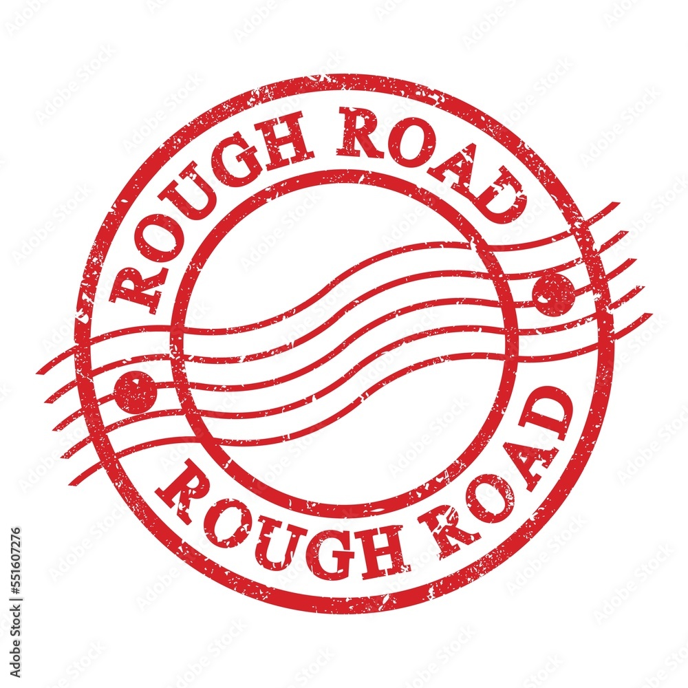 ROUGH ROAD, text written on red postal stamp. ROUGH ROAD, text written on red postal stamp.