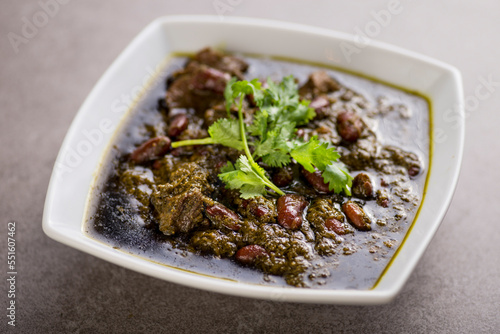 khoresh sabzi served in dish isolated on grey background top view of arabic food photo