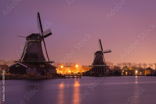 Traditional dutch windmills at Zaanse Schans by sunset