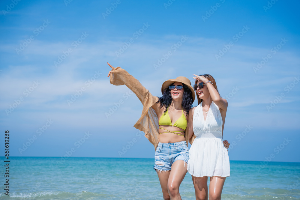 Happy girls enjoying freedom and walking on the beach., Summer holidays and vacation concept.. Happy girls enjoying freedom and walking on the beach., Summer holidays and vacation concept..