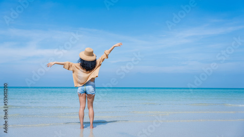 Happy girls enjoying freedom with open hands on the beach., Summer holidays and vacation concept..