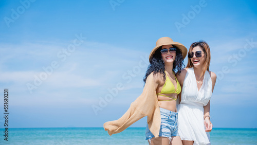 Happy girls enjoying freedom and walking on the beach., Summer holidays and vacation concept..