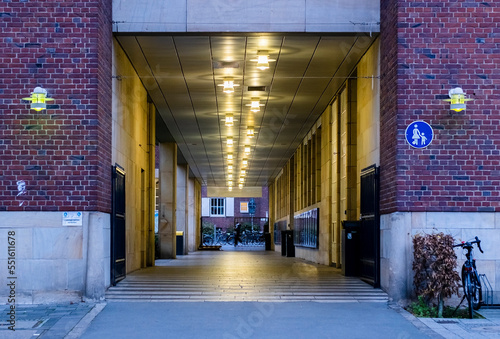 the entrance to a building and the street behind it. photo