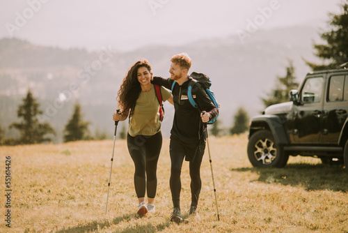 Smiling couple starting wal...
