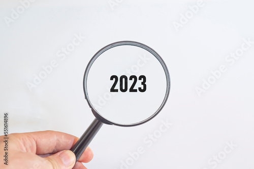 2023 was written with a magnifying glass. sustainable future idea.new business goal strategy concept.2023 goal planning business concept