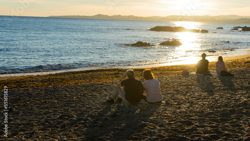 couple watching a sunset on the beach
