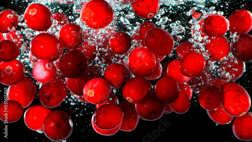 Fresh red cranberries falli...