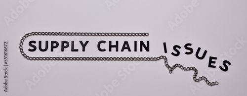 Принти на полотні Supply Chain issues concept. Black letters with steel chain.