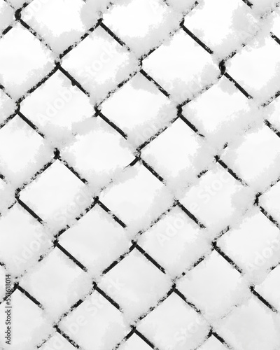 Snow piled on the wire of a diamond pattern mesh black fence in closeup during winter