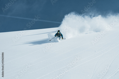 Man skiing in deep powder snow, Gastein, Salzburg, Austria photo