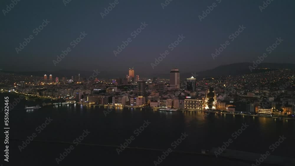 Aerial night shot over the sea with the ferryboats and city views in Konak Izmir Turkey. High quality 4k footage Aerial night shot over the sea with the ferryboats and city views in Konak Izmir Turkey. High quality 4k footage