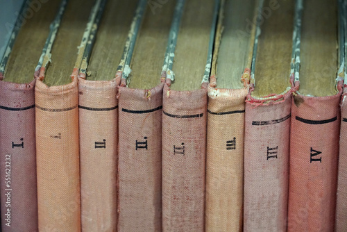 Covers of old books bound in cloth and volume numbers on the spine