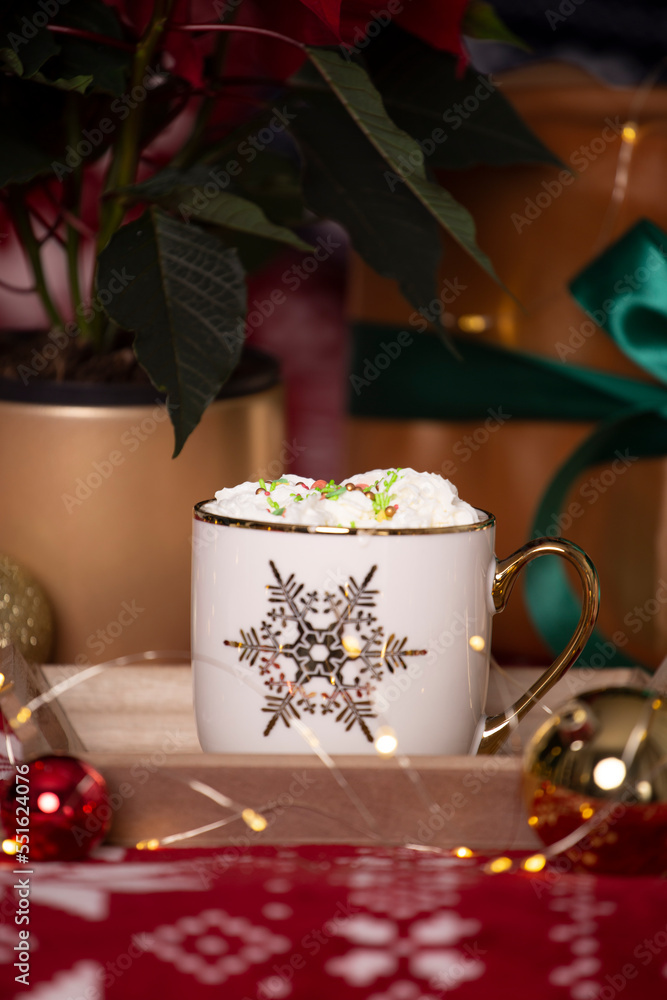 winter coffee with whipped cream in a Christmas decoration