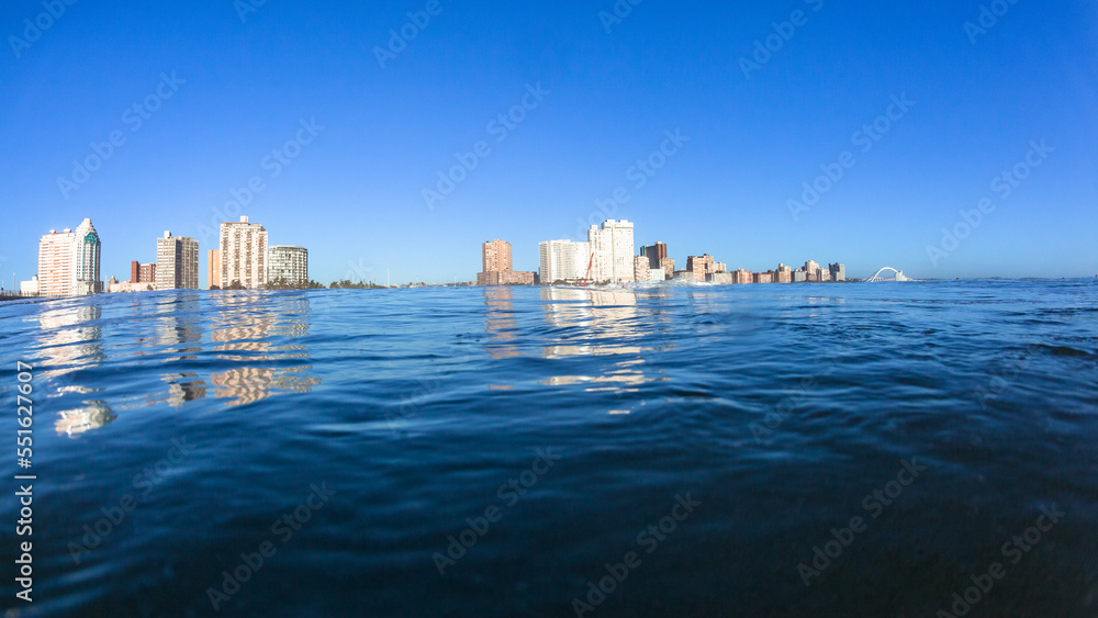 Durban Beachfront Skyline Hotels Apartment Buildings Scenic Ocean Swimming Water Surface Photograph View of Coastline.