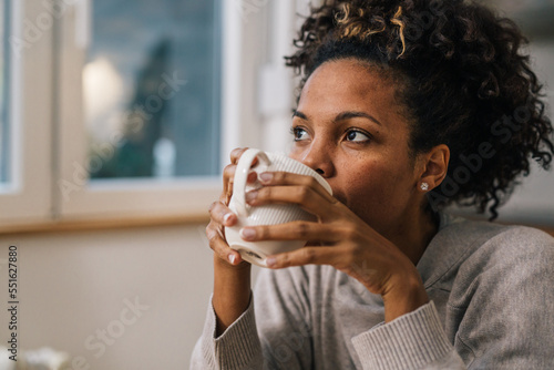 Close up view of a beautiful woman drinking coffee