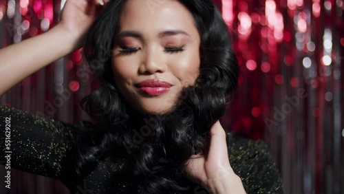 Wallpaper Mural Young beautiful woman dancing over red shiny background. Torontodigital.ca