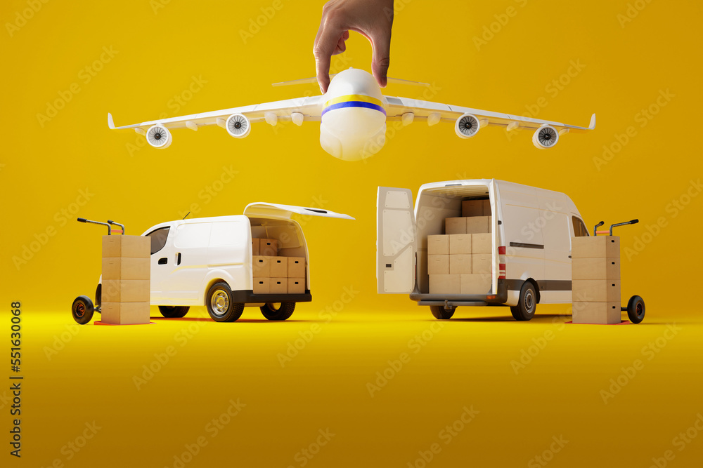 Two delivery white vans with cardboard boxes with hand holding airplane over them on yellow