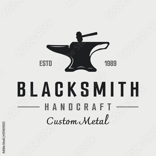blacksmith anvil job logo vintage. With hammer and horseshoe isolated background.Logo for industry. workshop.