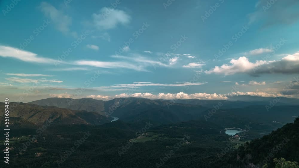 Timelapse of movement of clouds on azure blue of sky. Smooth motion, bright sky over the highlands gradually becomes darker, clearer and crystal blue. Beautiful sunset landscape of hilly green area. Timelapse of movement of clouds on azure blue of sky. Smooth motion, bright sky over the highlands gradually becomes darker, clearer and crystal blue. Beautiful sunset landscape of hilly green area.