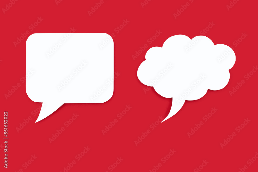 Two speech bubbles of different shapes on a red background. Empty speech bubbles in the form of a square and a cloud. Free space for text. The concept of speech communication or chat on the Internet Two speech bubbles of different shapes on a red background. Empty speech bubbles in the form of a square and a cloud. Free space for text. The concept of speech communication or chat on the Internet