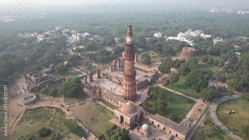  Aerial Drone footage of  Qutub Minar a Unesco world heritage site in New Delhi  capital city  of India  monuments of Delhi  during the day . photo