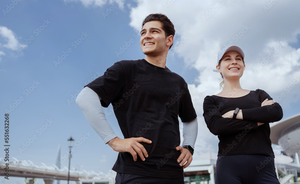 Friends of a woman and a man running together fitness training in sportswear. Healthy lifestyle of young people. Friends of a woman and a man running together fitness training in sportswear. Healthy lifestyle of young people.