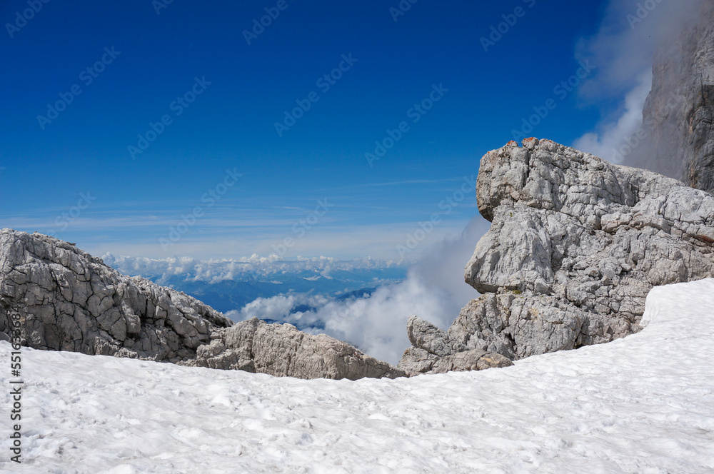 Snow near the peak of Dachstein: Rocks and wonderful view into the surrounding nature. 