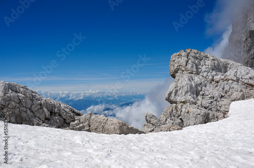 Snow near the peak of Dachstein  Rocks and wonderful view into the surrounding nature. 
