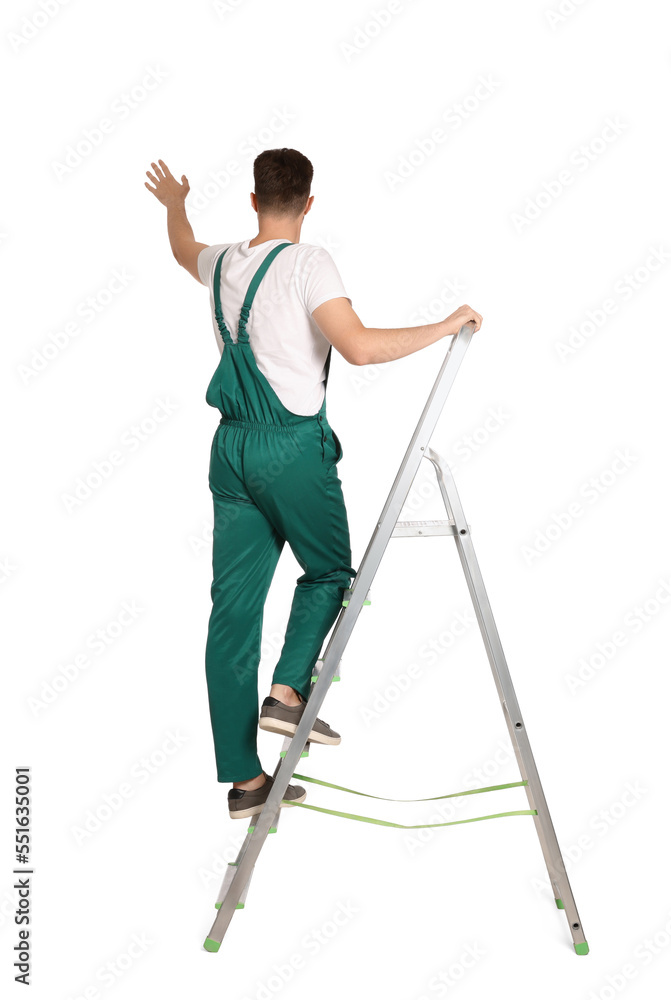Worker in uniform climbing up metal ladder on white background Worker in uniform climbing up metal ladder on white background