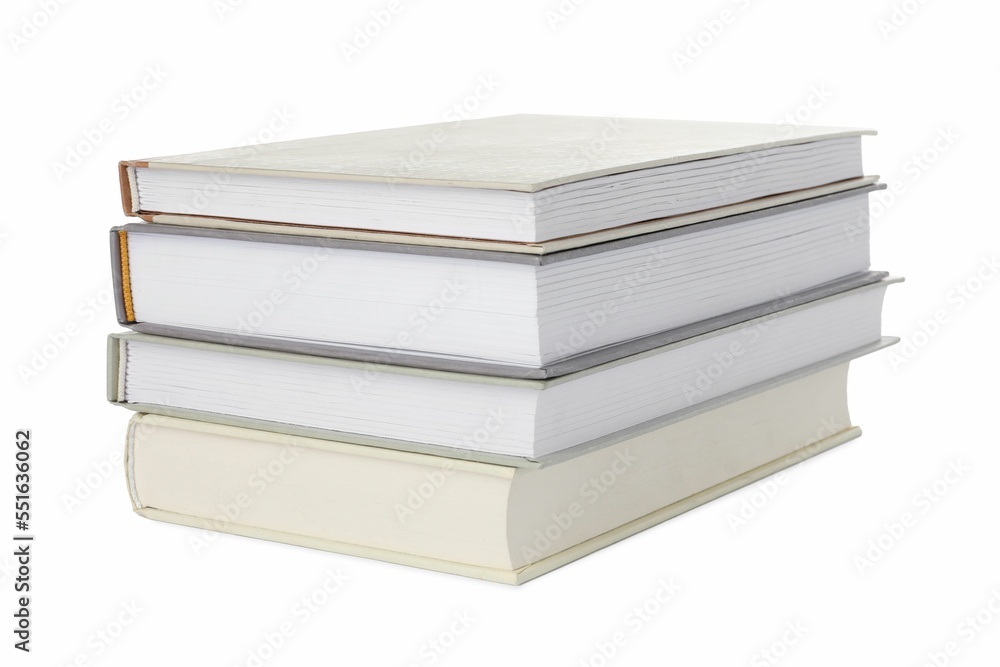Many different books stacked on white background Many different books stacked on white background