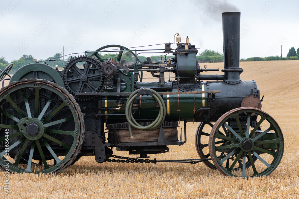 A restored ploughing engine in a field