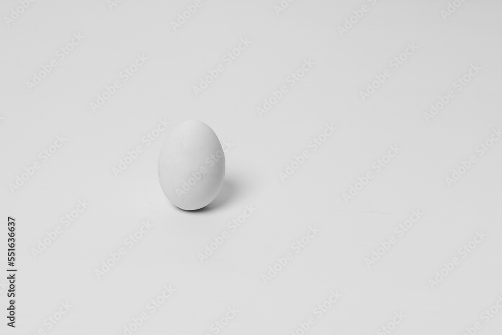 White egg isolated on white background. Eggs are on the table. White egg isolated on white background. Eggs are on the table.