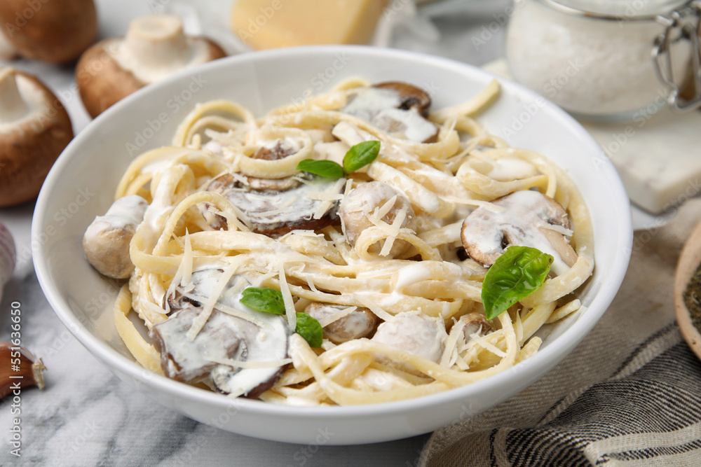 Delicious pasta with mushrooms on white marble table, closeup Delicious pasta with mushrooms on white marble table, closeup