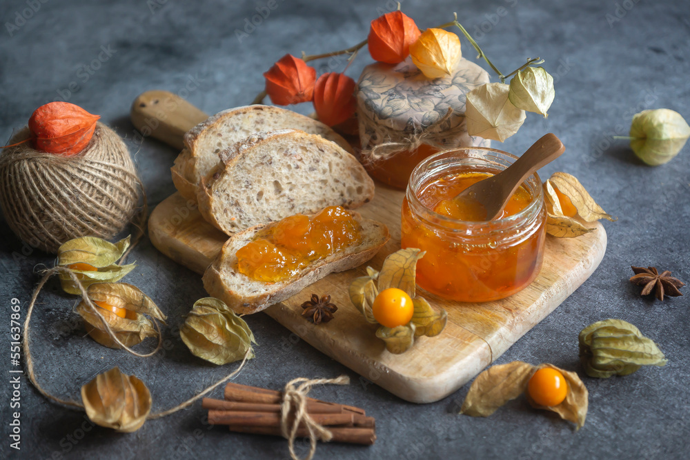 Fototapeta premium Tasty, fragrant jam and physalis fruits on the table.