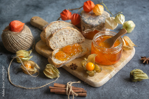 Tasty, fragrant jam and physalis fruits on the table.