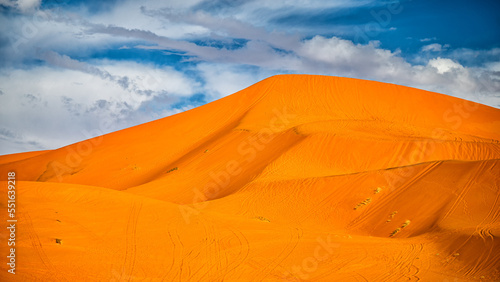 Sahara Desert sand dunes background. Popular travel destination, Erg Chebbi, Sahara Desert, Morocco.