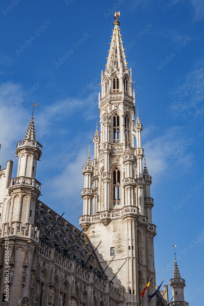 Spire of the Town Hall building at the center of the ornate, gothic, historic Grand Place city square in downtown Brussels, Belgium