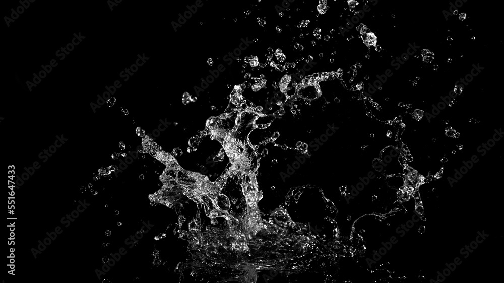 Water splash isolated on black background.