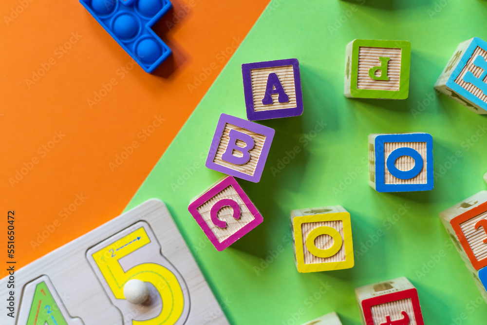 Wooden toys, blocks with abc, with numbers. Preschool, elementary school education. Development games for kids. Educational daycare toys. Wooden toys, blocks with abc, with numbers. Preschool, elementary school education. Development games for kids. Educational daycare toys.