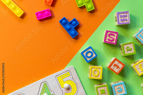 Fototapeta Naklejka Na Ścianę i Meble -  Wooden toys, blocks with abc, with numbers. Preschool, elementary school education. Development games for kids. Educational daycare toys.	