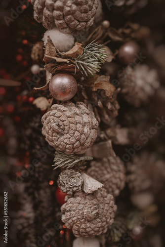  christmas decorations brown cones in a beige background in close-up
