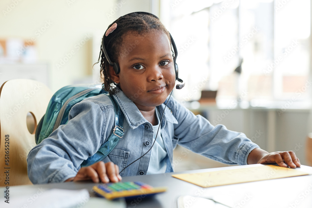 Portrait of cute black girl playing home office work with calculator and looking at camera Portrait of cute black girl playing home office work with calculator and looking at camera