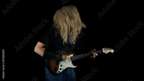 Heavy Metal Guitarist Playing Guitar And Headbanging
 photo