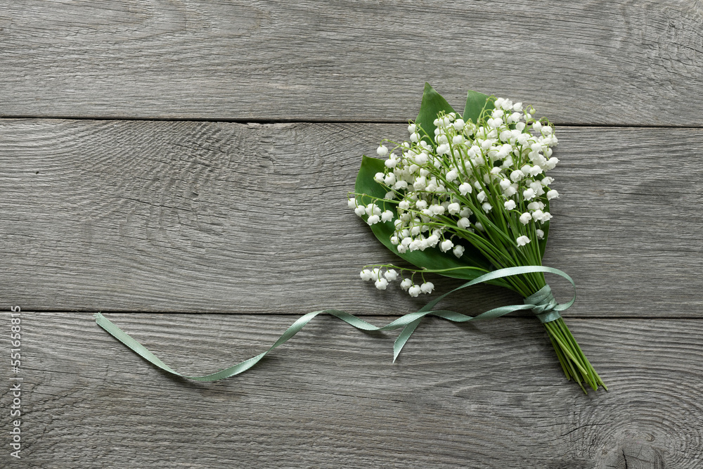 Lily of the valley flowers on wooden rustic background. Beautiful ...