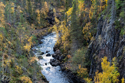 Water flowing in rapids in a canyon in autumnal Oulanka National Park, Northern Finland