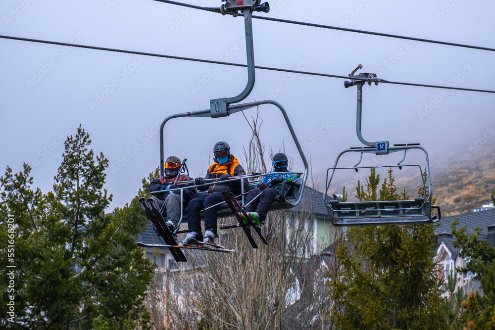 SIERRA NEVADA, Spain - February 05, 2022: View of people ski lift in Sierra Nevada Capped Mountain SIERRA NEVADA, Spain - February 05, 2022: View of people ski lift in Sierra Nevada Capped Mountain