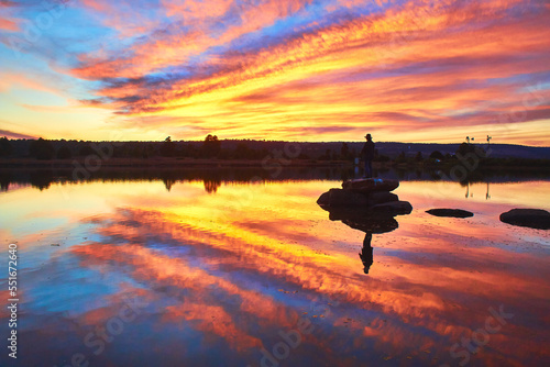 alone man in middle of a lake in an amazing sunset, gamboas lagoon in monte escobedo zacatecas  photo