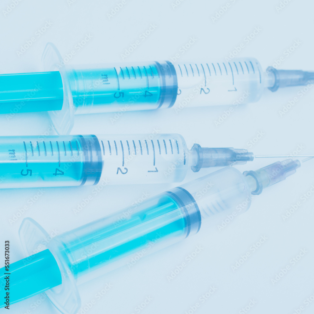 Medical syringe on a white background. A syringe for injection. The concept of health and beauty Medical syringe on a white background. A syringe for injection. The concept of health and beauty