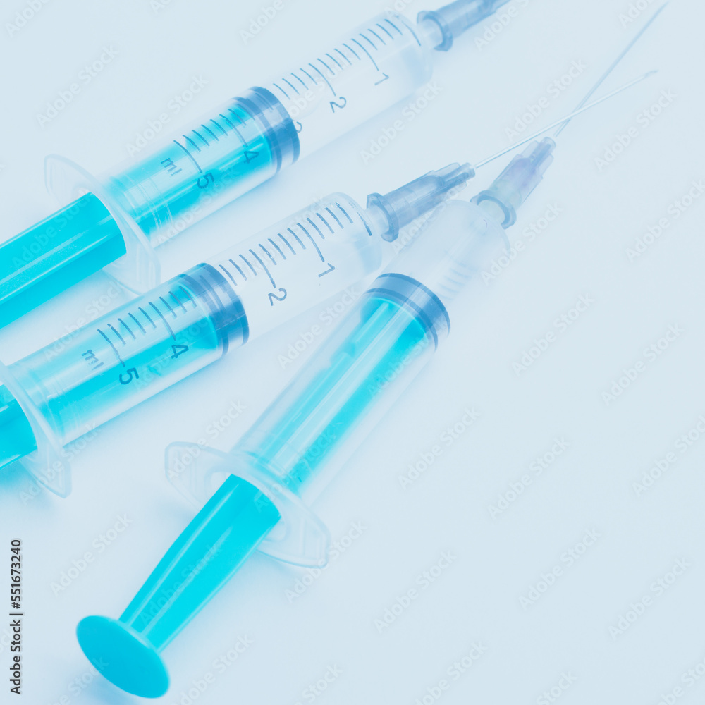 Medical syringe on a white background. A syringe for injection. The concept of health and beauty